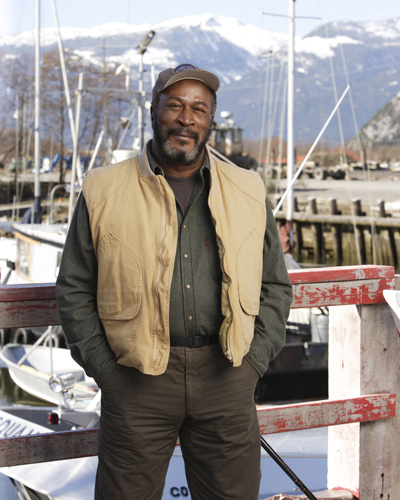 Amos, John [Men in Trees] Photo