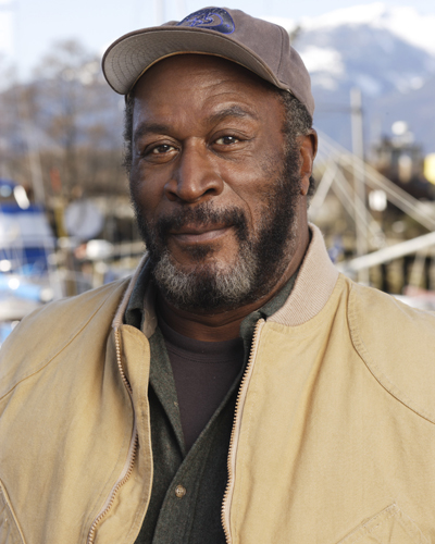 Amos, John [Men in Trees] Photo