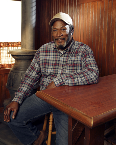 Amos, John [Men in Trees] Photo